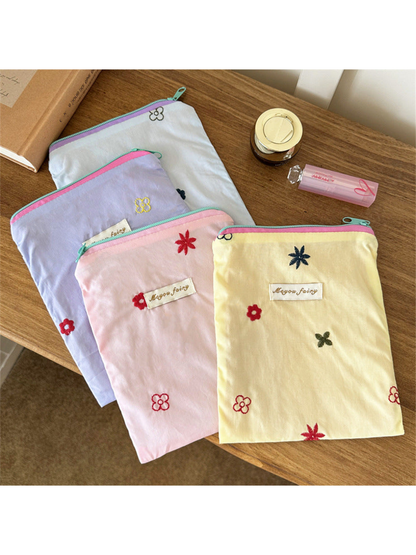Pink, Blue, Yellow and Purple floral embroidered pouches displayed together