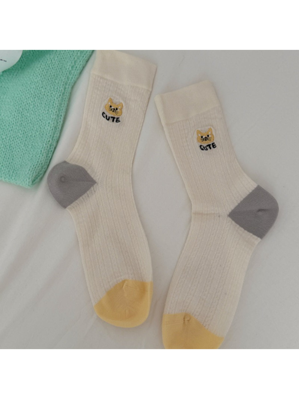 Model wearing Rufia soft cat knit crew socks with casual shoes