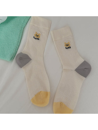 Model wearing Rufia soft cat knit crew socks with casual shoes