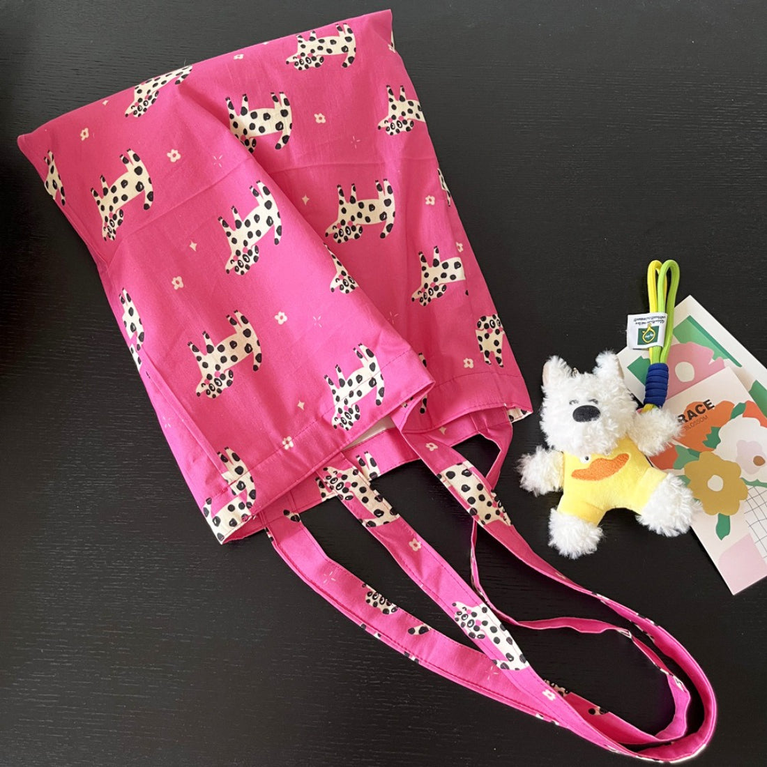 Cosbai pink tote bag with playful puppy print and sturdy handles