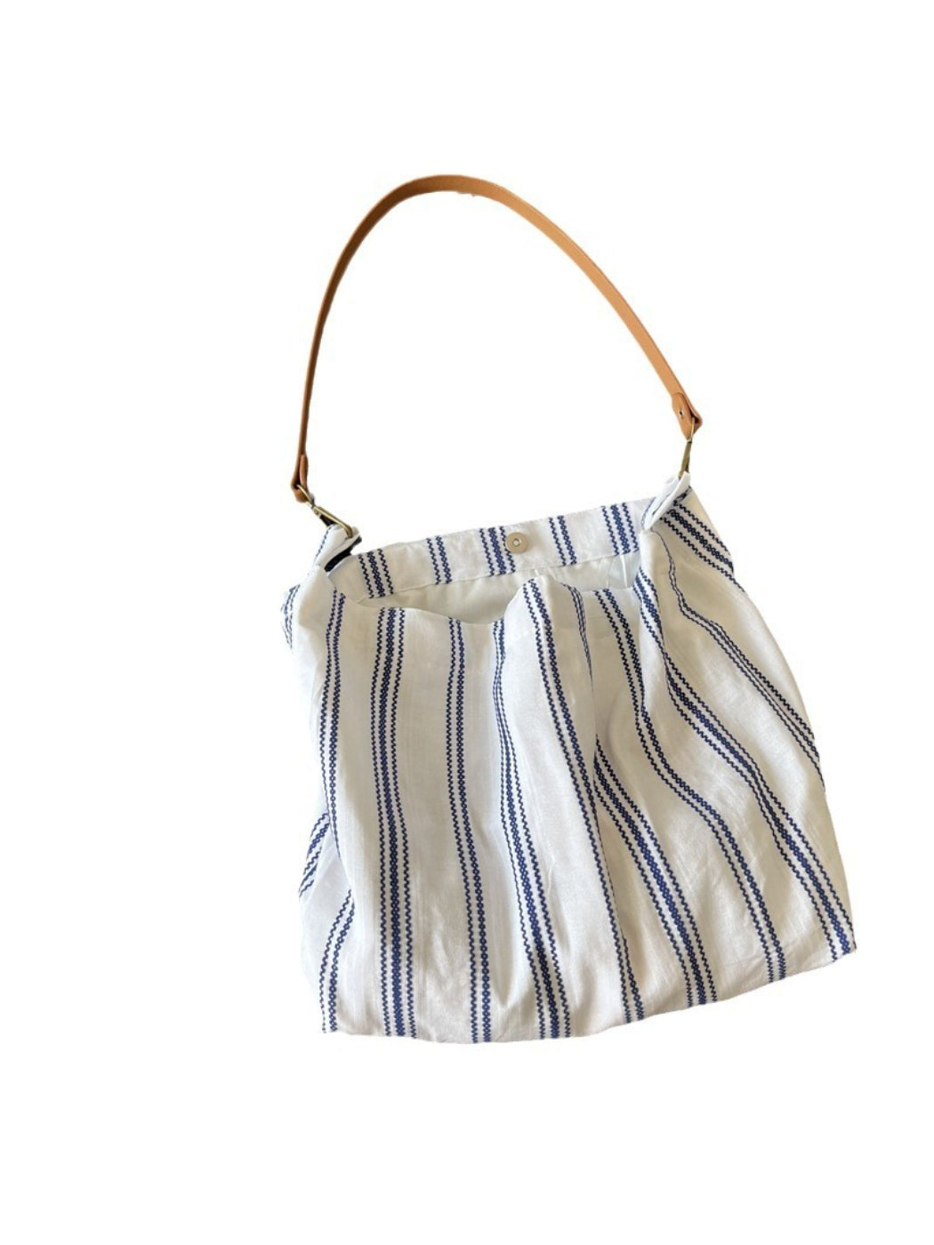 Side view of Cosbai blue stripe slouch shoulder bag highlighting its slouchy shape and blue stripes