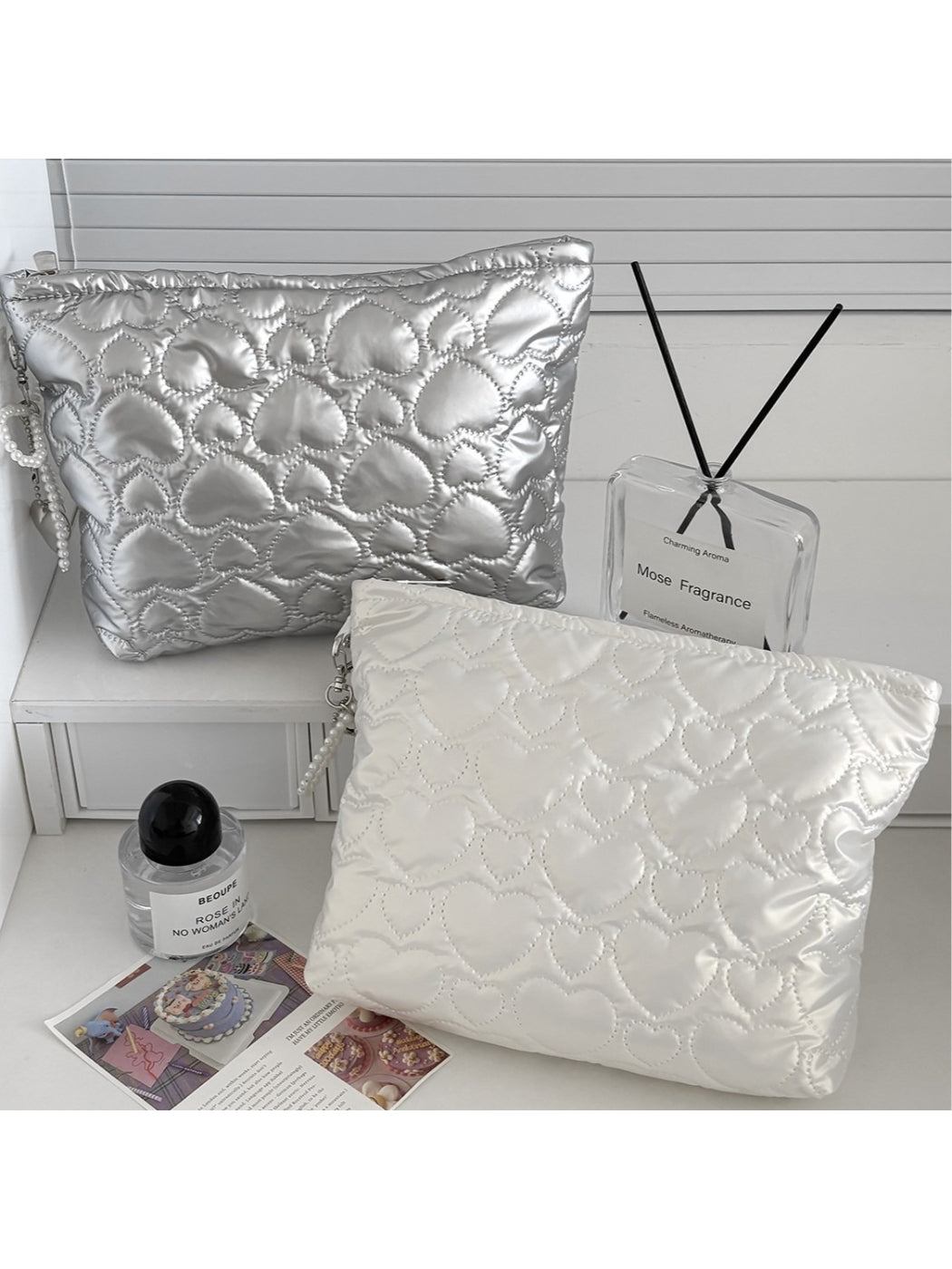 Cosbai cosmetic bag with heart pattern and zipper on a white background