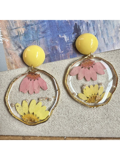 Side view of clear floral statement earrings highlighting translucent petals