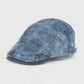 Close-up of Haila washed denim plaid vintage newsboy cap fabric texture and stitching