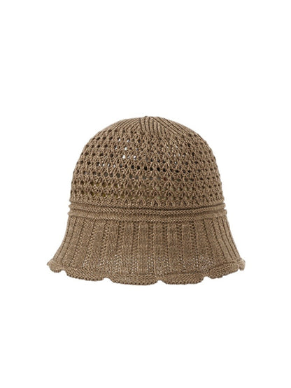 Model wearing the Haila open knit summer bucket hat outdoors in natural light