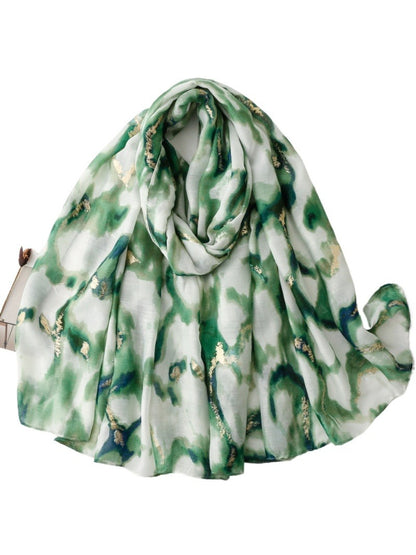 Scarf styled as a head wrap showcasing the marble design and soft material