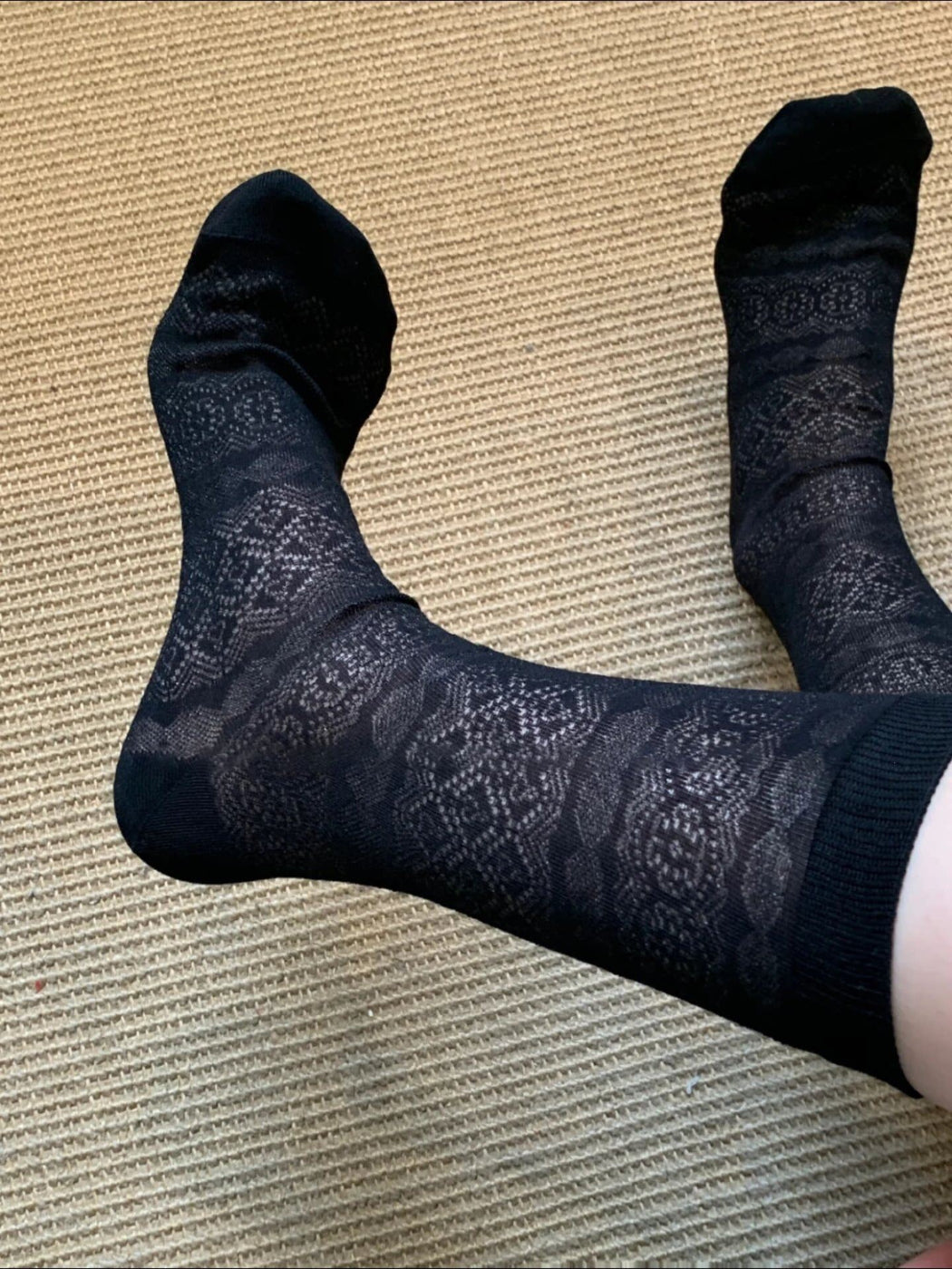 Rufia floral mid-calf socks laid out to show full floral pattern and mid-calf length