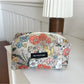 Cosbai Floral Bunny Makeup Pouch shown from a side angle emphasizing the printed design