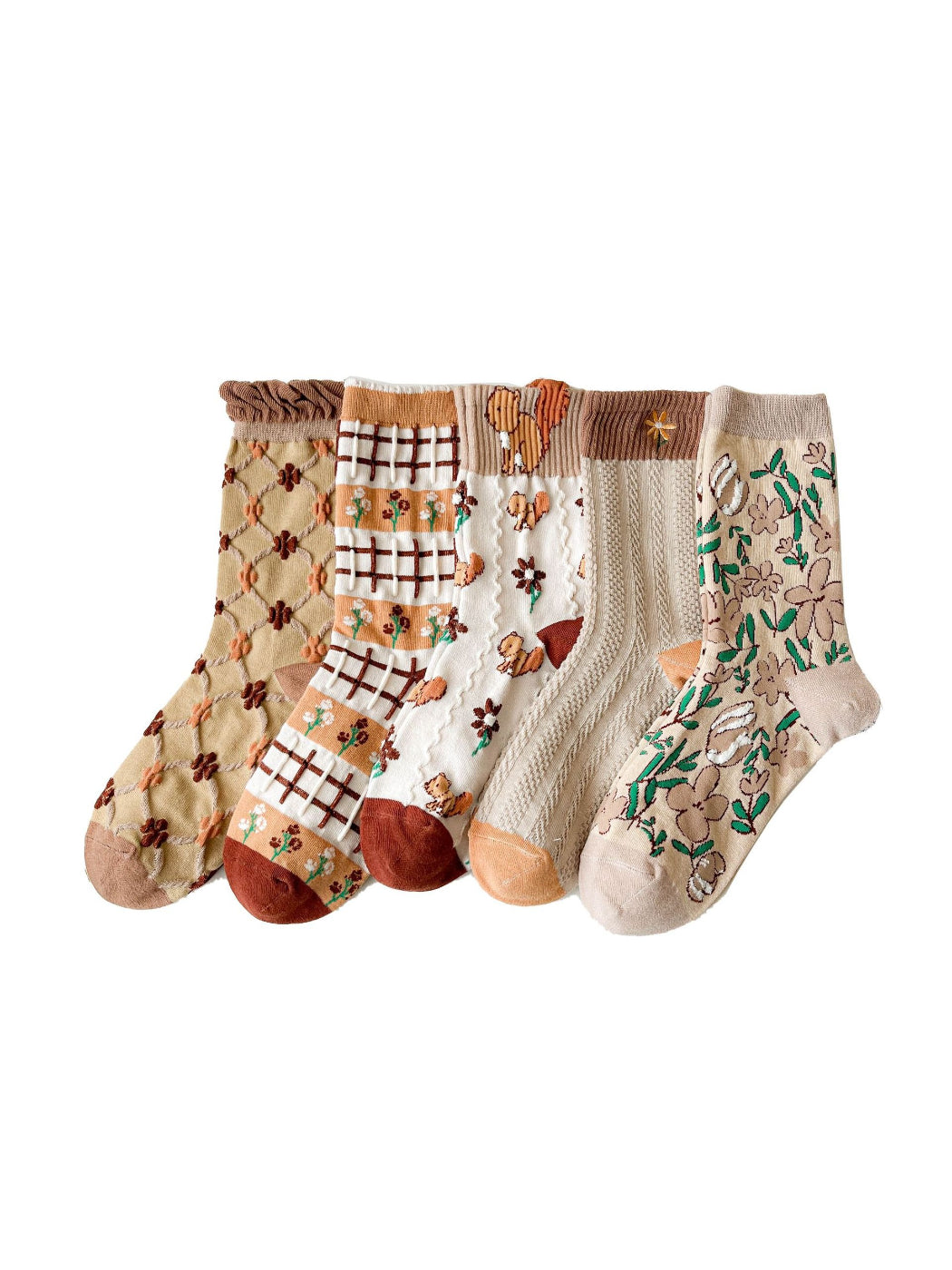 Pair of Rufia Woodland Bloom mixed crew socks with floral and leaf patterns