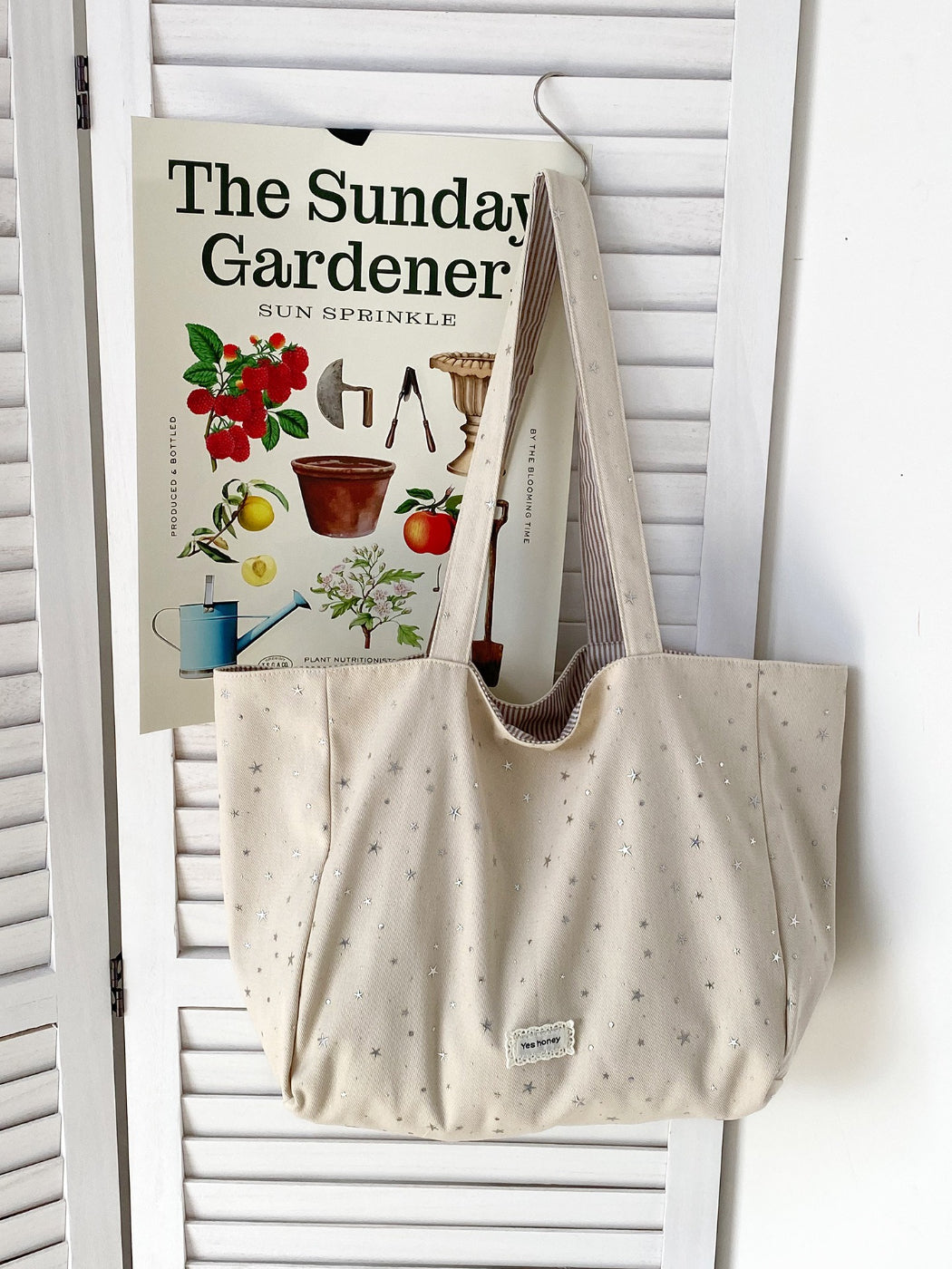 Top view of Cosbai Star Print Tote showing open interior and soft shoulder straps