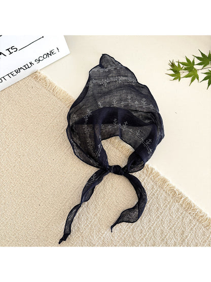 Scarvii lightweight textured tie head scarf tied around a ponytail on model