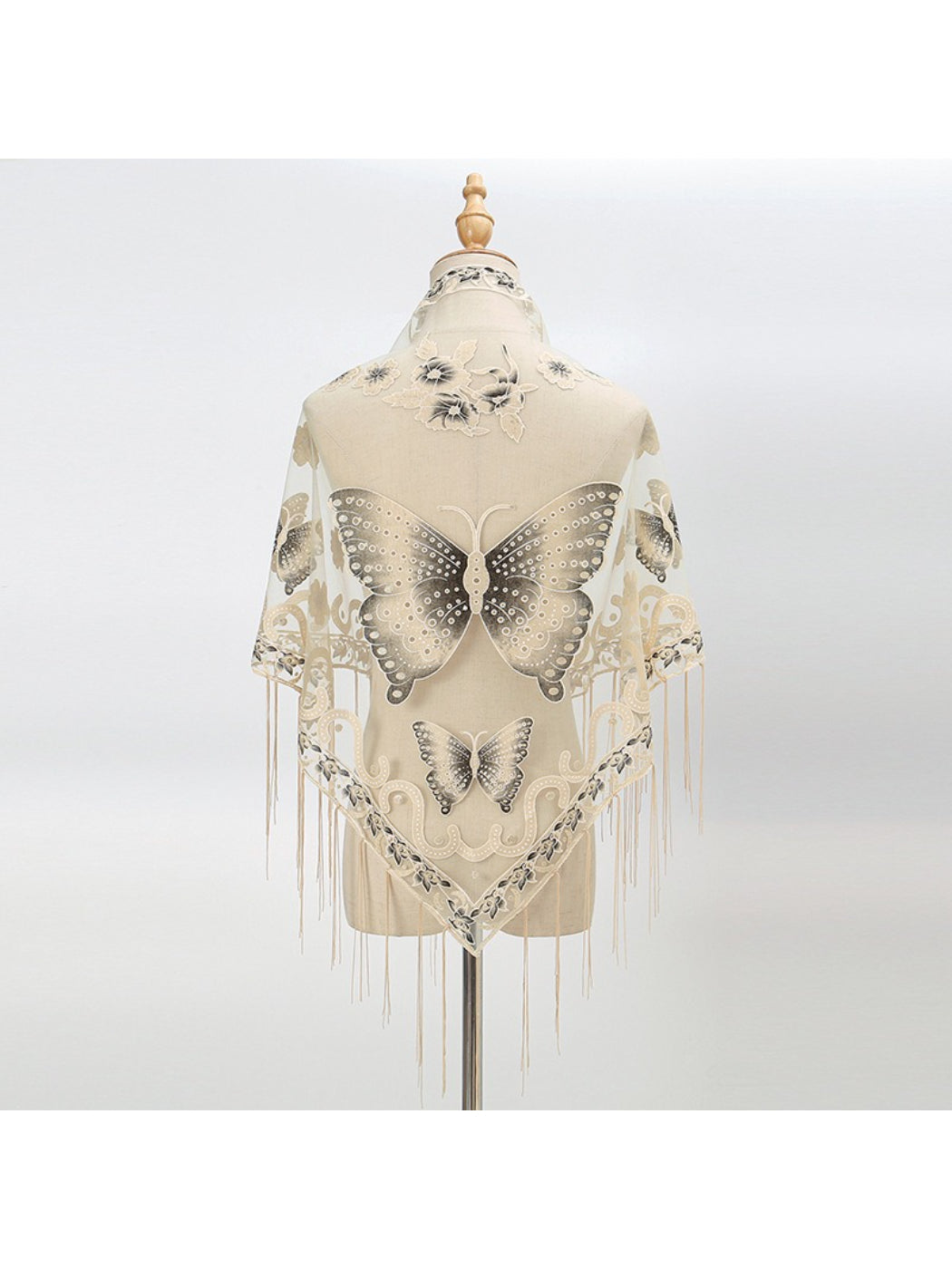 Side view of model wearing Scarvii Butterfly Fringe Triangle Scarf showing drape and fringe detail