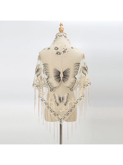 Side view of model wearing Scarvii Butterfly Fringe Triangle Scarf showing drape and fringe detail