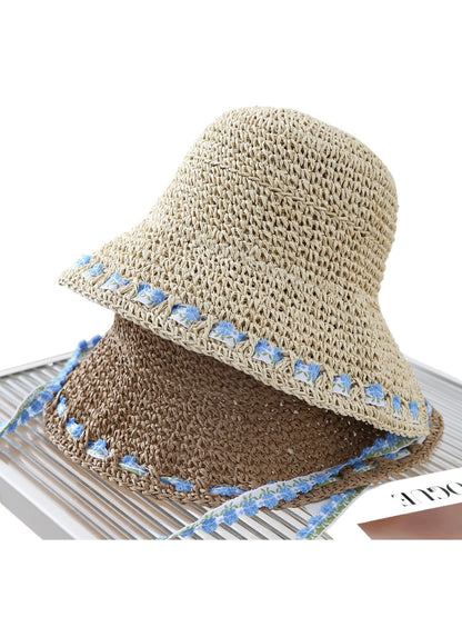 Haila floral trim straw bucket hat displayed on a white background