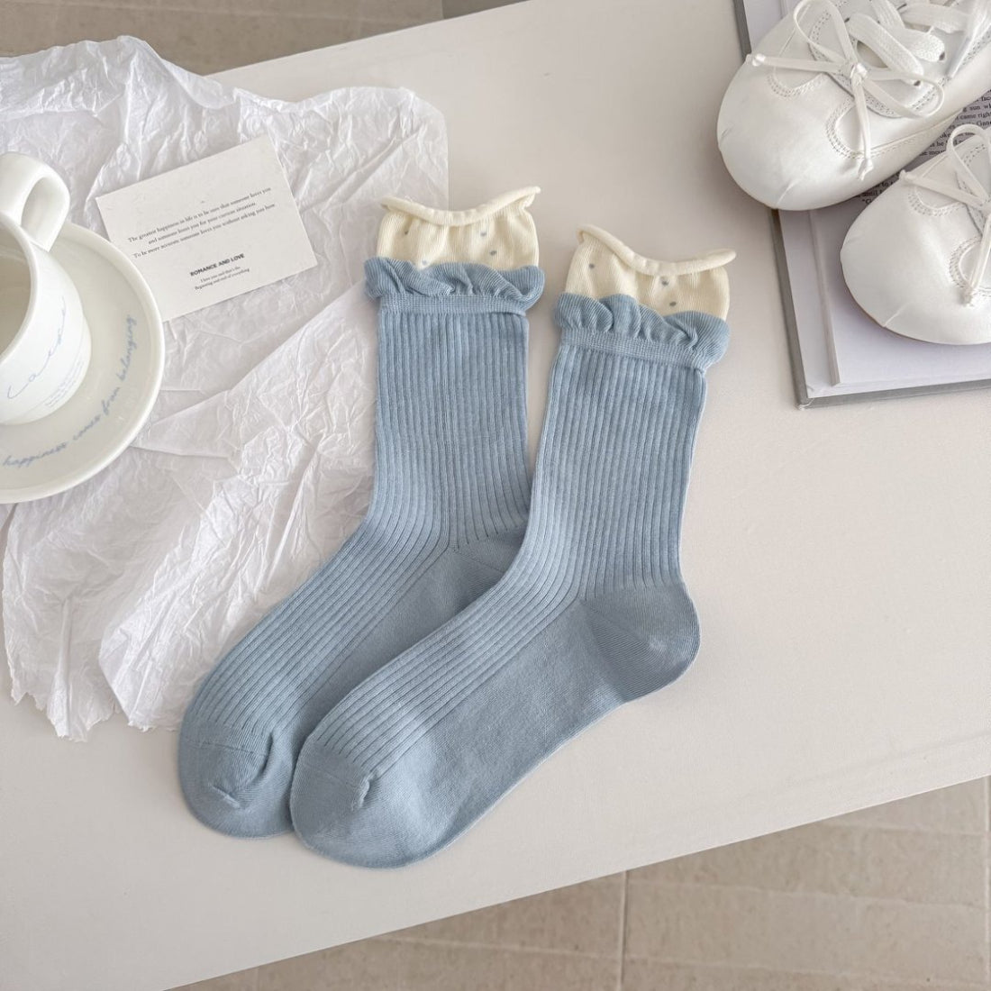 Rufia socks paired with rolled-up jeans showing fit and style