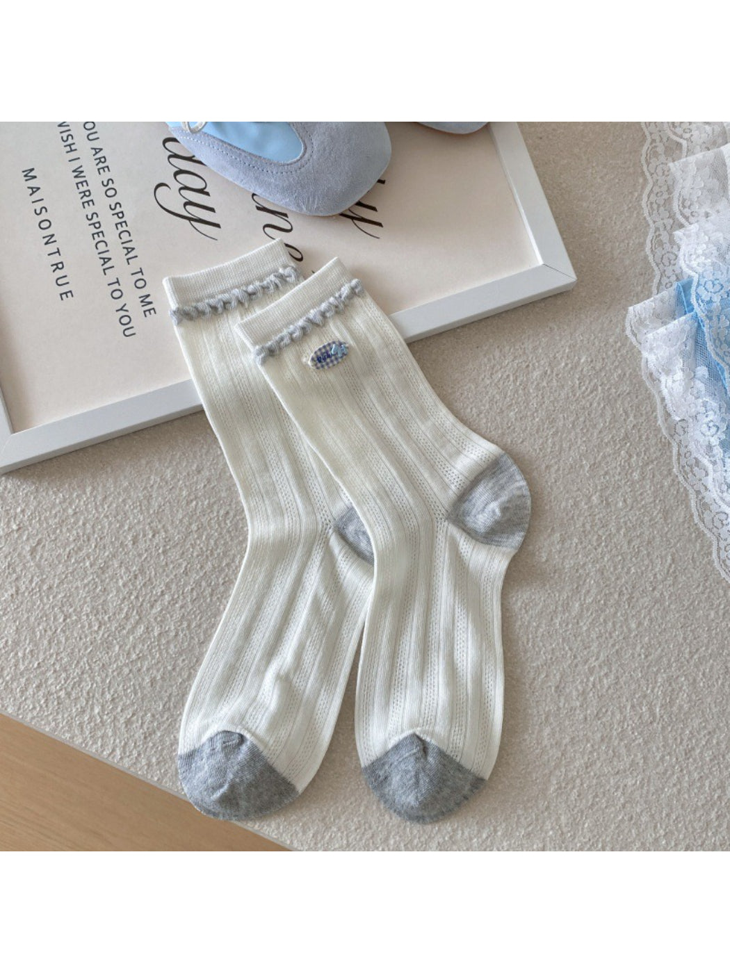 Top view of Rufia crew socks highlighting ribbed cuff detail