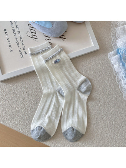 Top view of Rufia crew socks highlighting ribbed cuff detail
