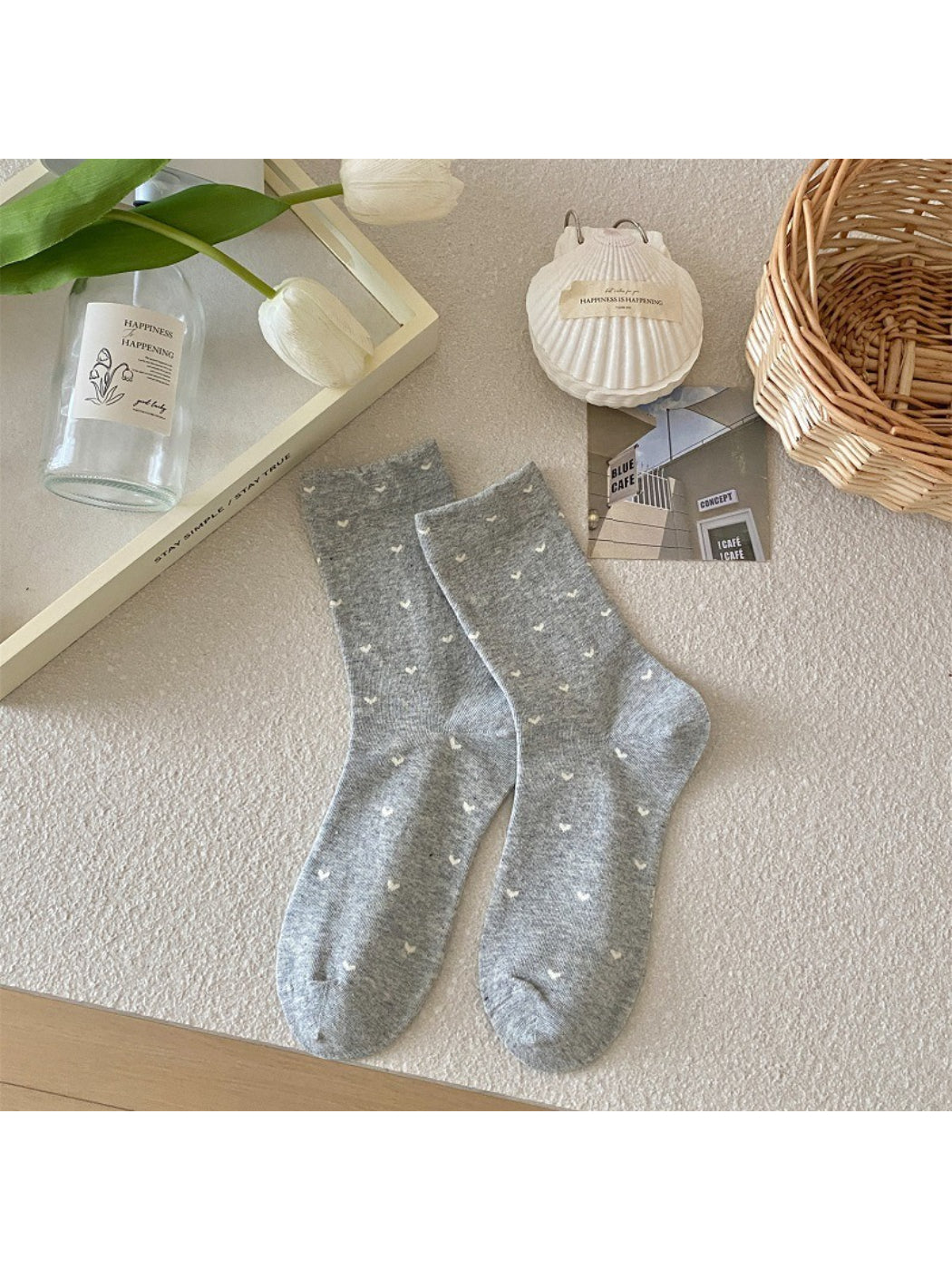 Stack of Rufia mixed print crew socks showing different colorful designs