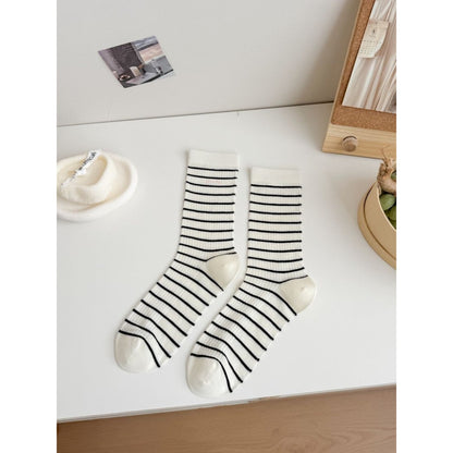 Model wearing Rufia Pretty Fine Stripe Crew Socks paired with rolled-up pants