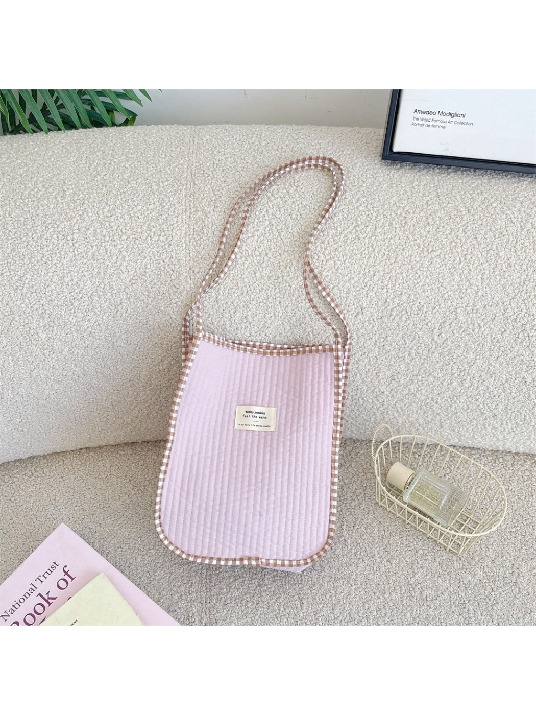 Cosbai Soft Gingham Trim Tote Bag hanging on a hook with black gingham trim visible