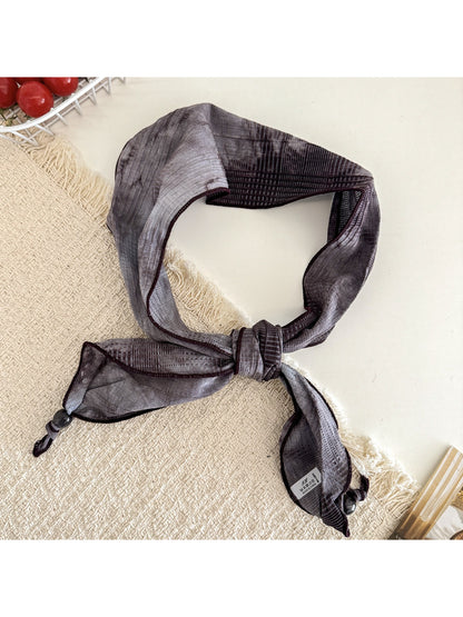Scarvii vintage plaid floral triangle scarf draped over shoulder highlighting colors
