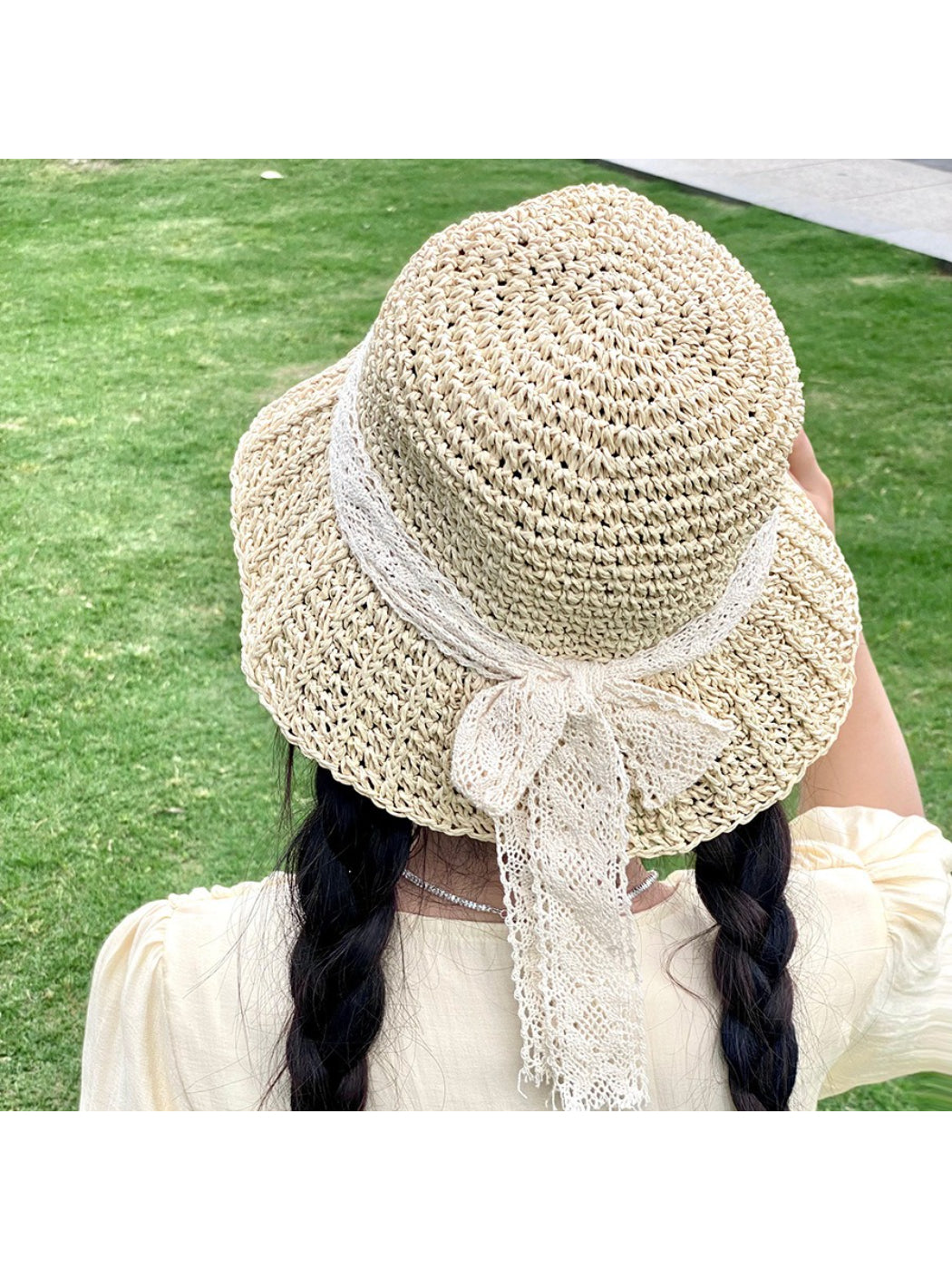 Haila straw sun hat with wide brim and decorative lace bow on side