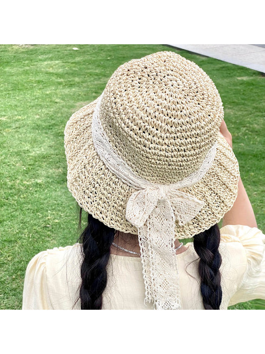 Haila straw sun hat with wide brim and decorative lace bow on side