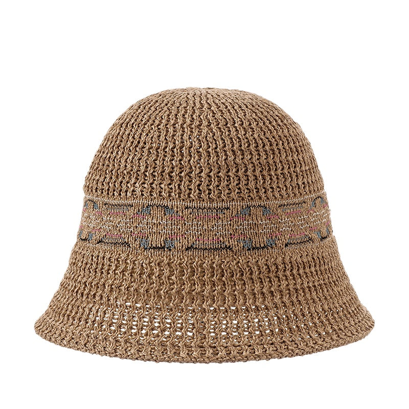 Haila summer hat placed on wooden surface with natural light