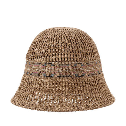 Haila summer hat placed on wooden surface with natural light