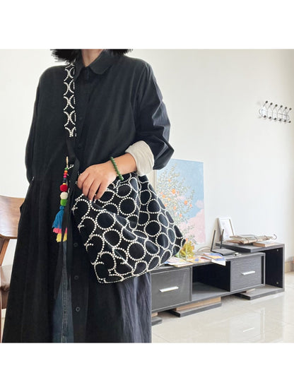 Side view of Cosbai shoulder tote highlighting spacious interior and sturdy handles