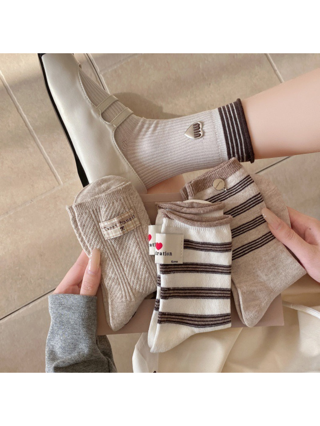 Pair of Rufia casual neutral crew socks displayed flat on a white background
