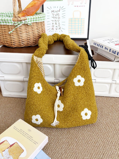 Top view of Cosbai knit bag highlighting drawstring and floral design
