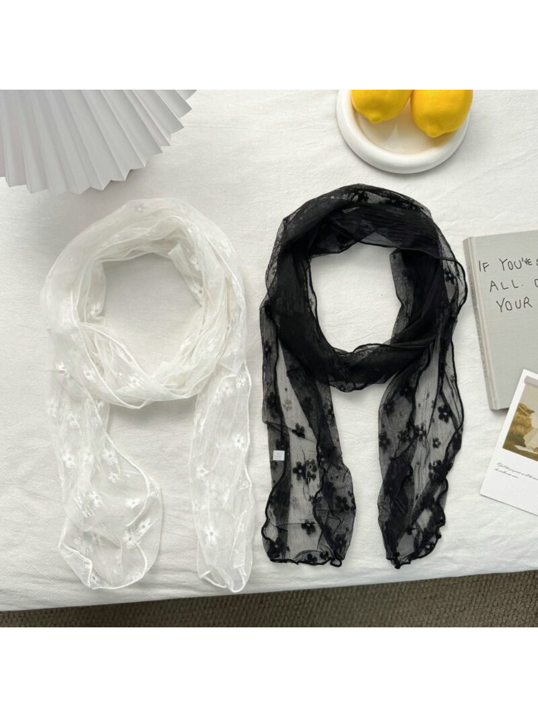 Close-up of Soft Blossom Sheer Scarf fabric highlighting delicate floral print and texture