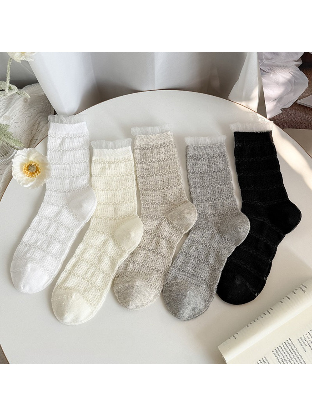 Close-up of Rufia textured everyday ruffle socks in beige with ruffled cuff