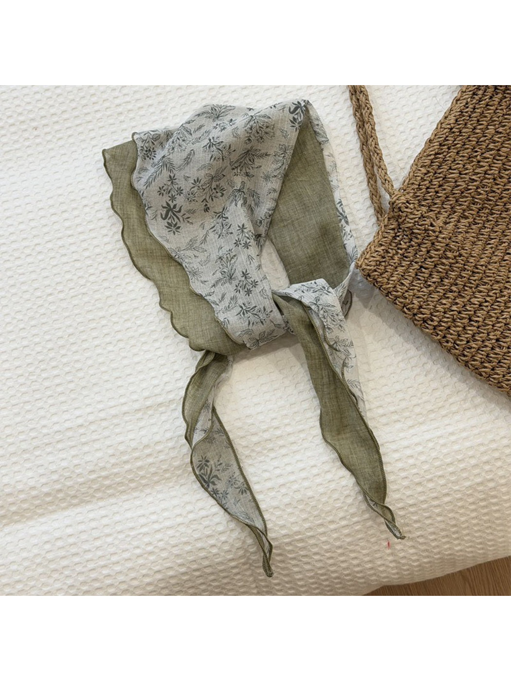 Model styling lightweight botanical triangle scarf as a head wrap
