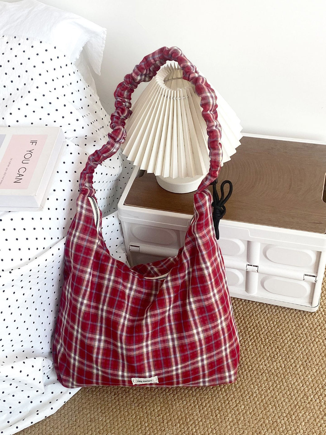 Close-up of plaid pattern and stitching on Cosbai slouchy shoulder bag