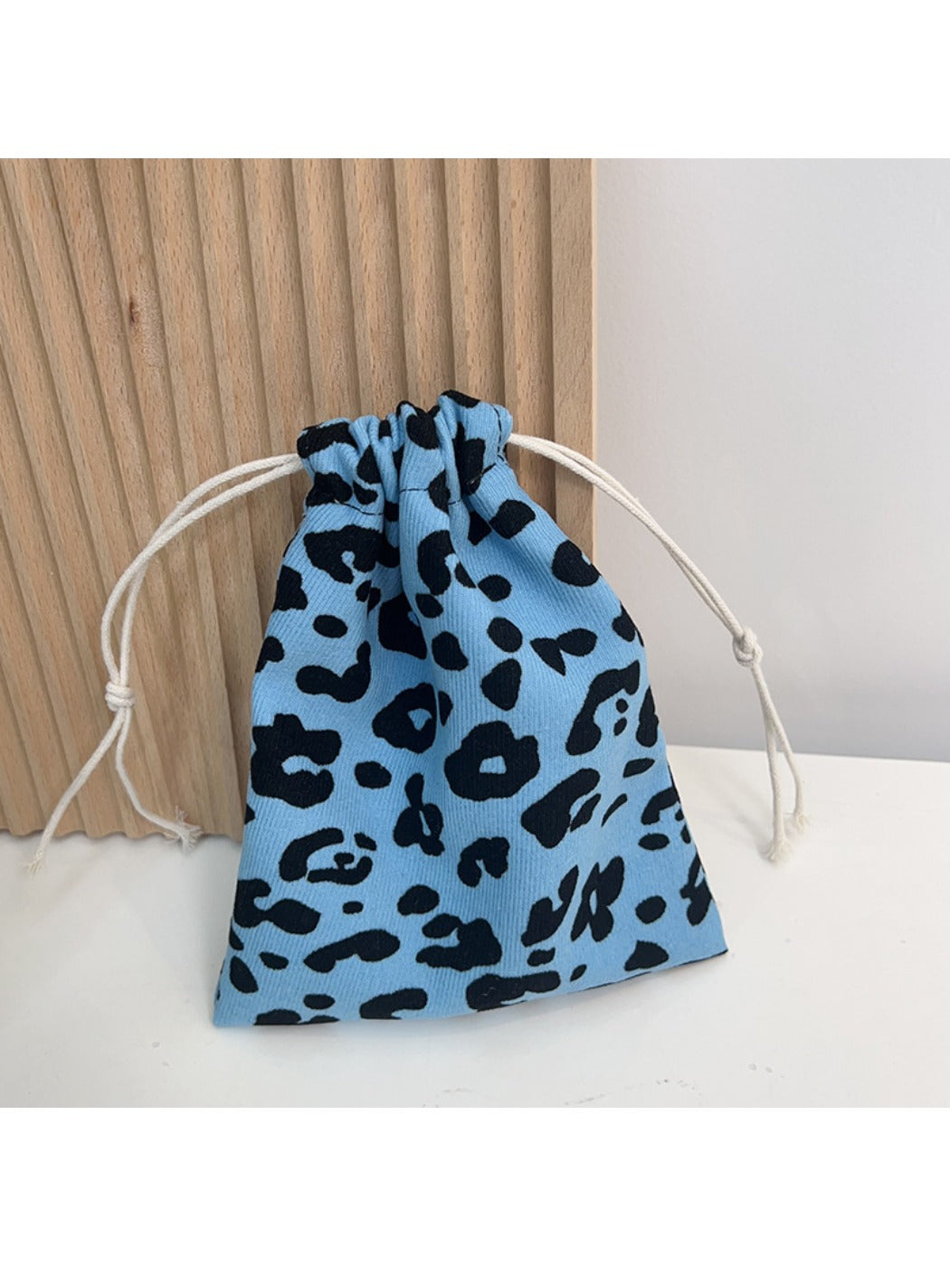 Cosbai Floral Pouch shown from side highlighting floral pattern
