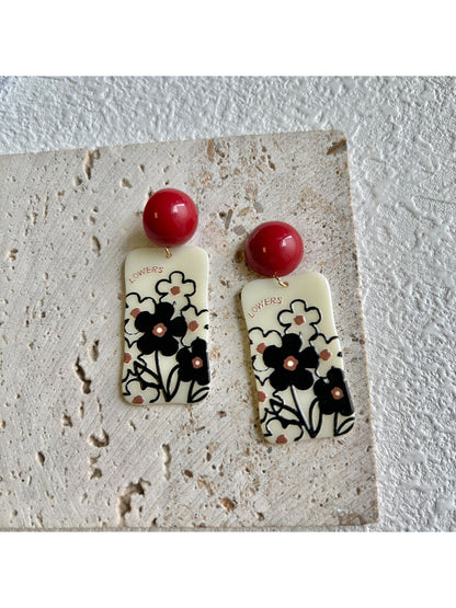 Earwish Graphic Floral Drop Earrings with pink and green floral design on gold-tone metal