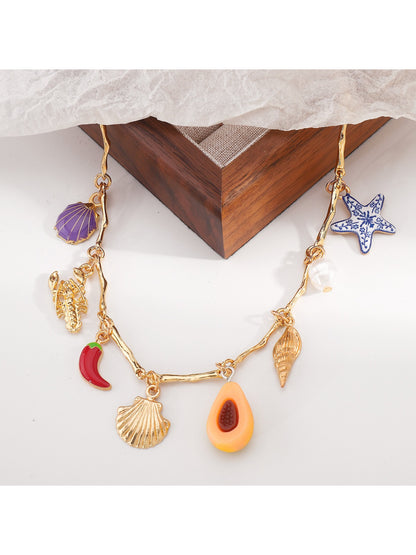 Color Charm beaded necklace laid out with beads in a gradient color pattern