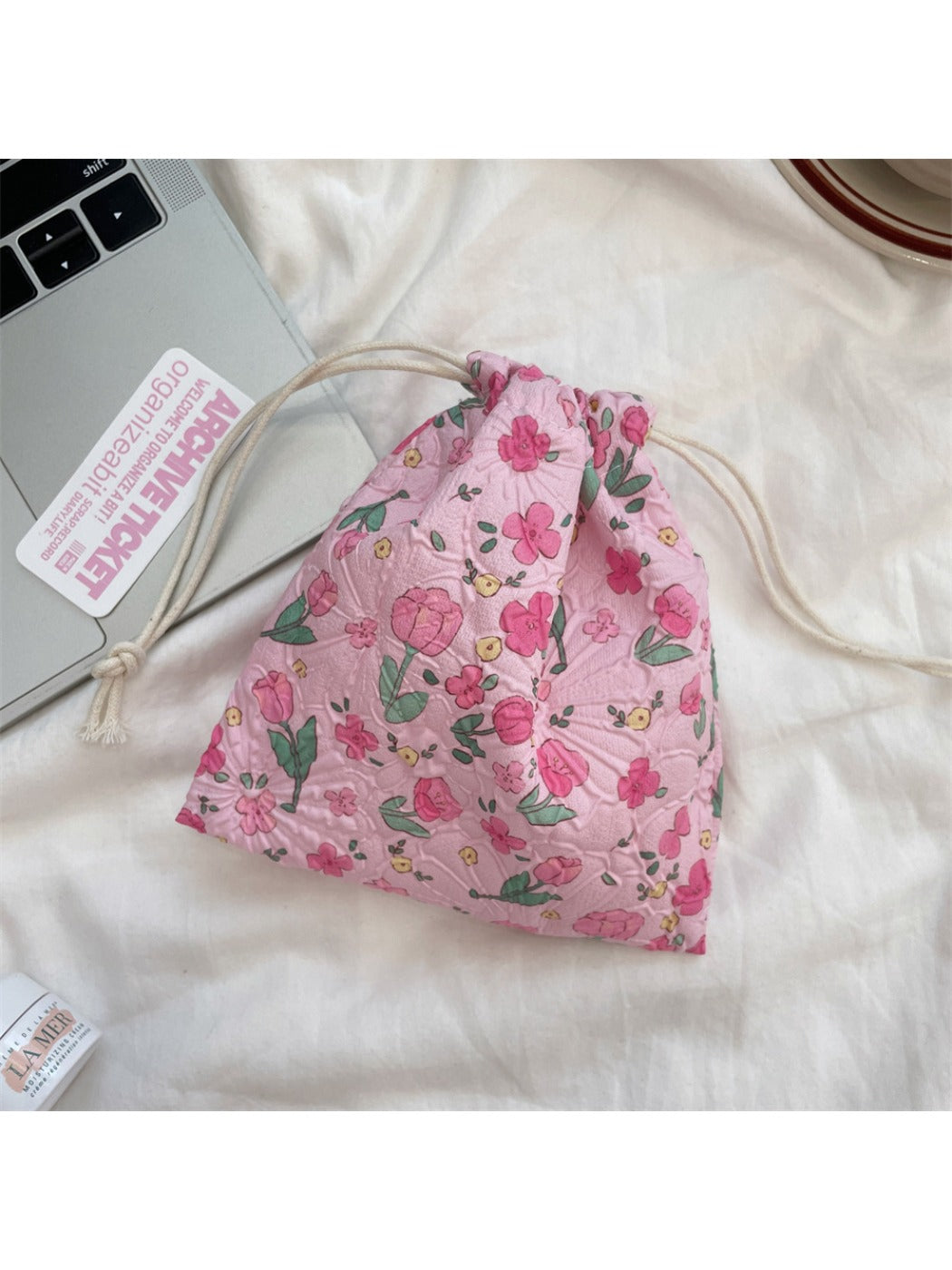 Cosbai cartoon drawstring pouch with drawstrings visible and pouch slightly open
