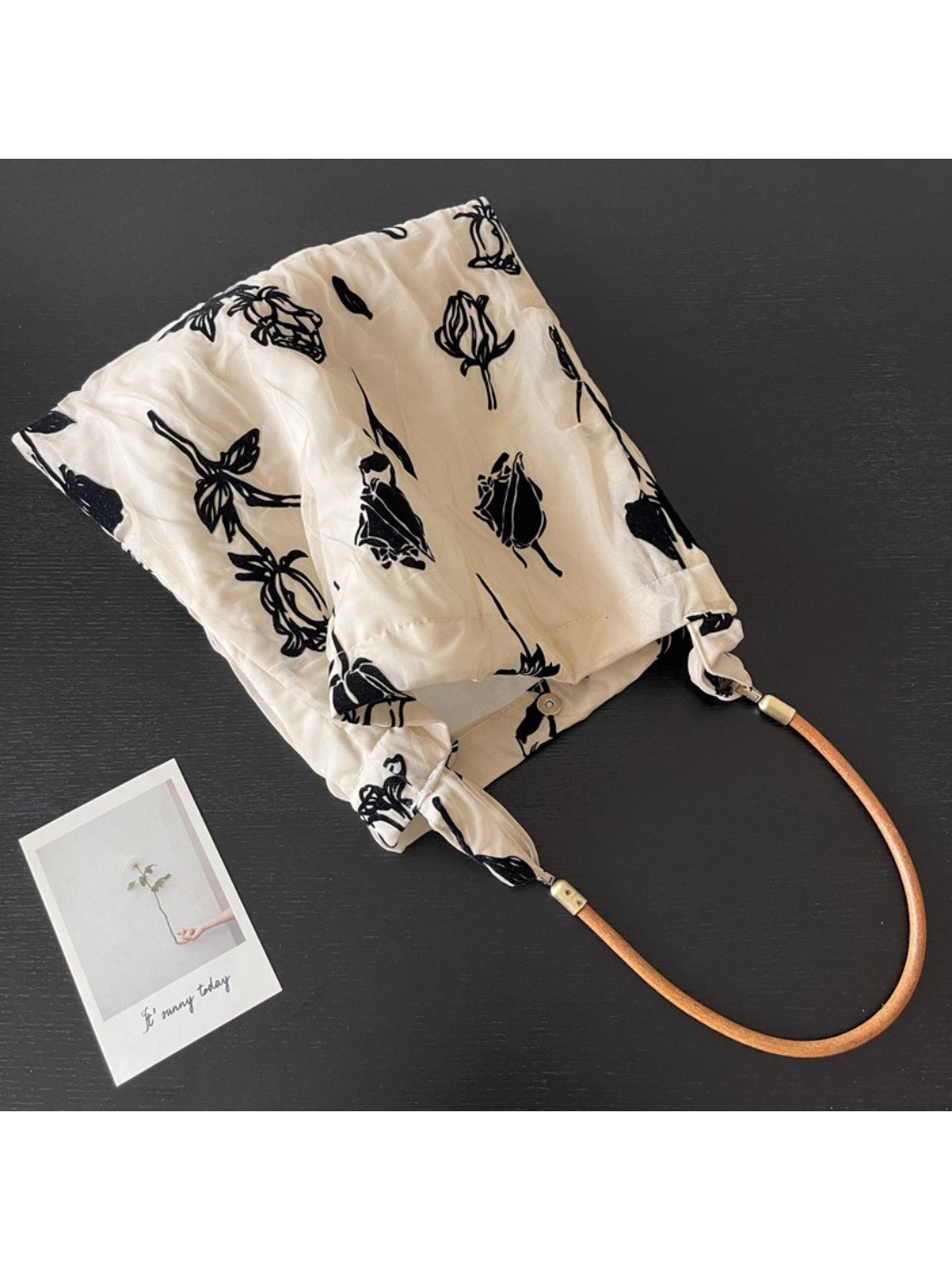 Side view of Cosbai Abstract Floral Slouch Shoulder Bag showing slouchy shape