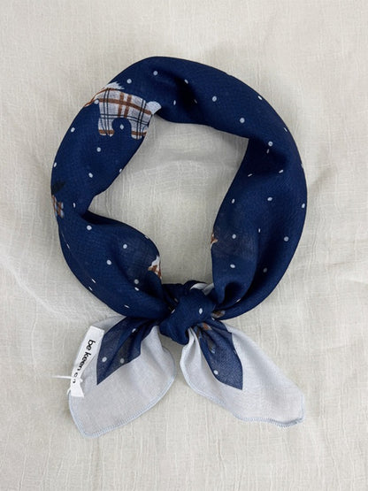 Close-up of Scarvii Sheer Pony Dot Square Scarf fabric texture with small black dots on white