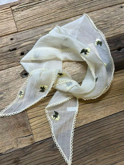 Scarvii triangle bandana scarf styled as headband showing floral design and soft fabric texture