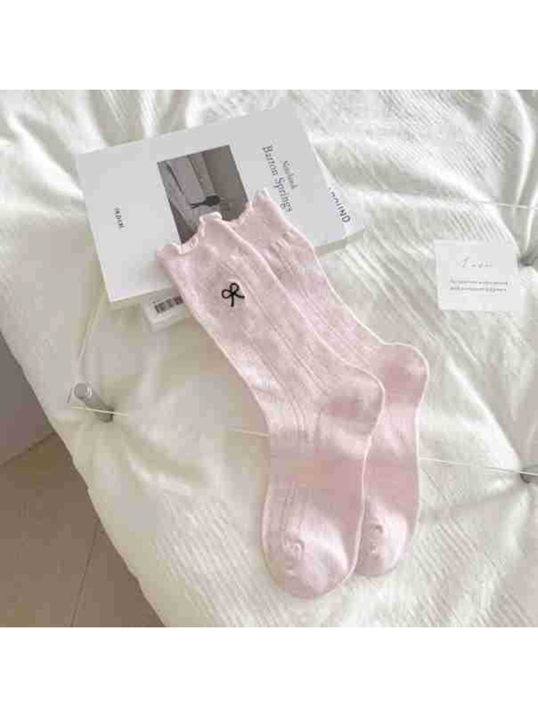 Rufia Tiny Ribbon Pointelle Socks styled with casual outfit on wooden floor background