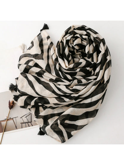 Close-up of Scarvii Zebra Stripe Tassel Scarf fabric texture and tassel detail
