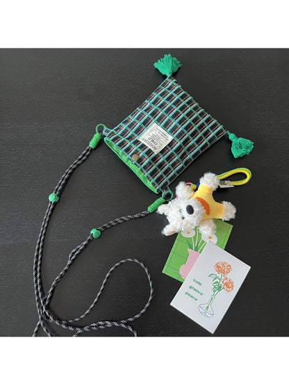 Cosbai phone bag showing front pocket and plaid pattern with dog charm