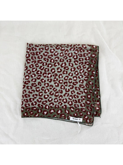 Close-up of Scarvii leopard print square scarf fabric and print details
