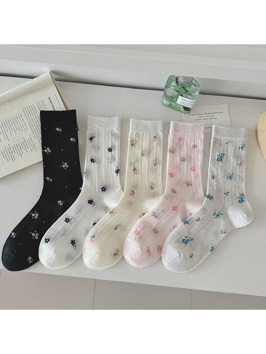 Pair of Rufia Ditsy Floral Ribbed Crew Socks with small floral pattern on white background