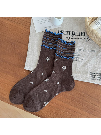 Rufia floral crew socks folded to show pattern and frill edge detail