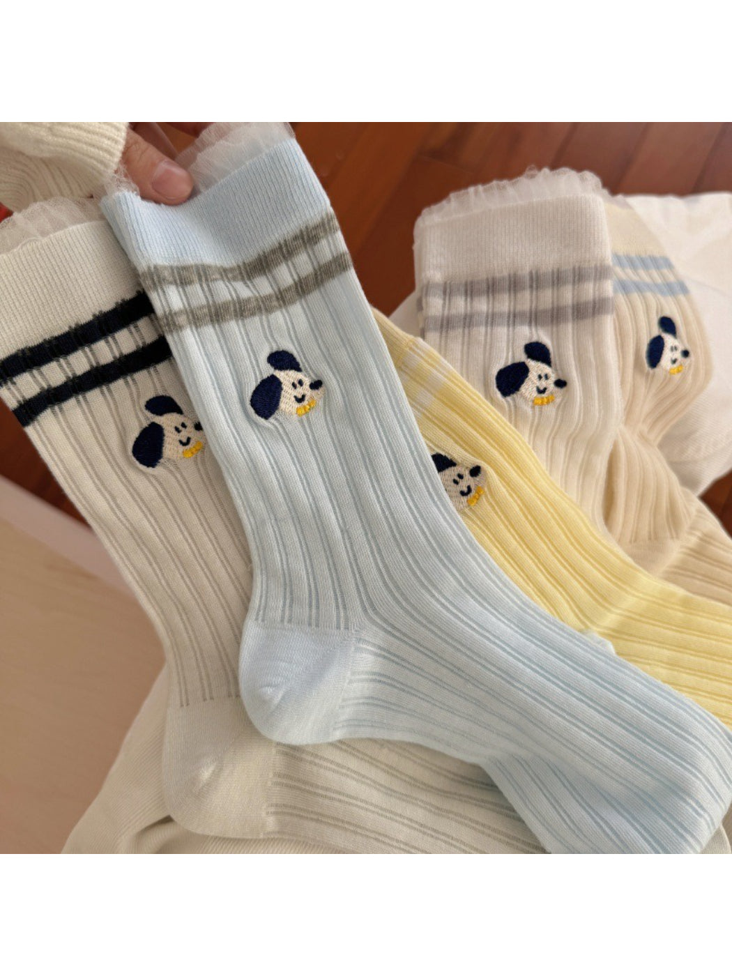 Model wearing Rufia Playful Pup Everyday Socks with casual shoes and jeans